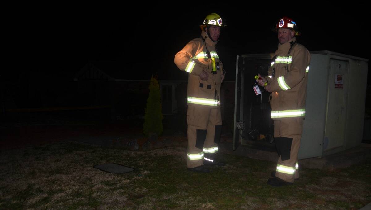 Senior firefighter Dean Brus and Glenn Kimpton joined other firefighters in extinguishing a fire in an electrical substation in Nicole Drive. Photo: Clare Colley. 
