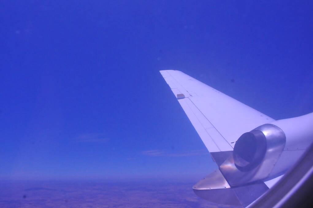 On a wing, turning for another look at Cadia. Orange Welcomes Brindabella Airlines Photo Jude Keogh