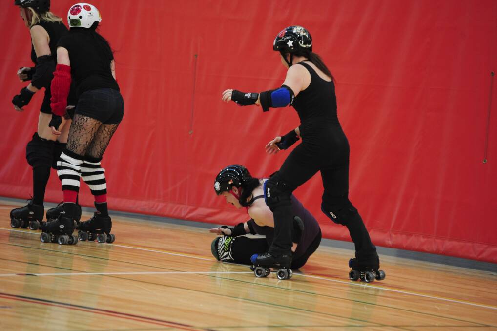 Orange Roller Derby League Training - Robyn Zombie crashes out Photo Jude Keogh
