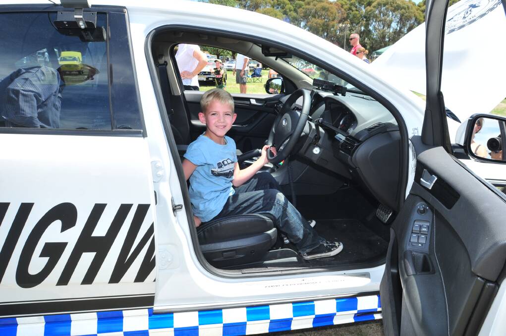 Declan John takes the drivers seat in the police highway patrol car