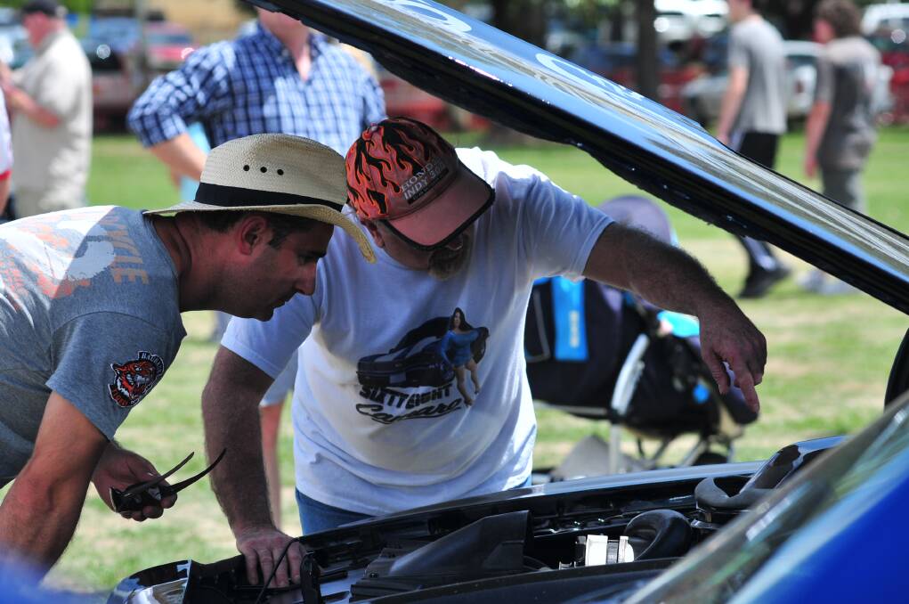 Marcus Kostitch and Steve Langham looking at Marcus's 1978 Transam