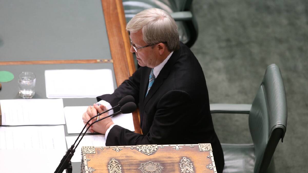 Prime Minister Kevin Rudd returns the House of Representatives at Parliament House in Canberra. Picture: 