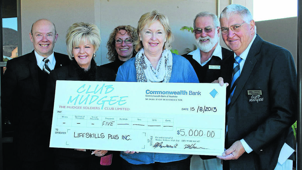 MUDGEE: Club Mudgee’s David Lang, Maureen Heywood, Judy Hitchcock, Fave Holden and Bill Kerr present Lifeskills Plus Carolyn Peek with the first of many donations.