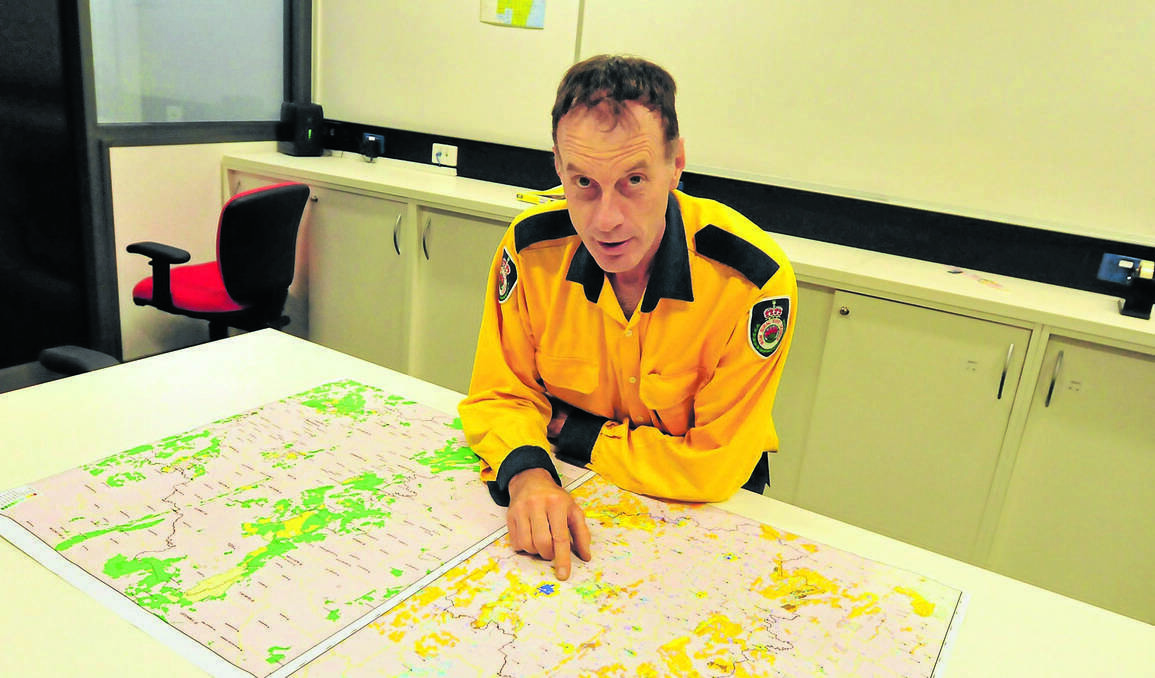 ORANGE: NSW Rural Fire Service Canobolas Zone operations officer Brett Bowden has urged members of the community to be more aware of their surroundings this bushfire season. He is pointing to areas that haven’t experienced fire since the 1960s. Photo: LUKE SCHUYLER.