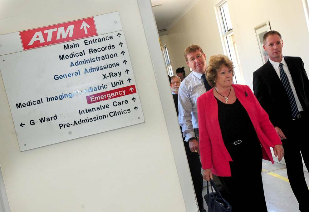 DUBBO: NSW Health Minister Jillian Skinner encouraged women aged 50 to 74 to have mammograms during her visit to Dubbo this week. She is pictured walking through Dubbo Hospital with Dubbo MP Troy Grant, Western NSW Local Health District chief executive Scott McLachlan and hospital general manager Debbie Bickerton (obscured). Photo: LOUISE DONGES