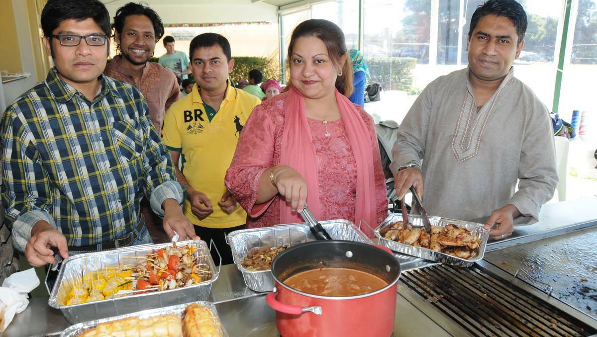 DUBBO: Parvez Alam, Fahdul Waham, MD Zahidul Haque, Chowdhury Beg and Shamima Kalam cook up a feast in celebration of the end of Ramadan. Photo: CHERYL BURKE