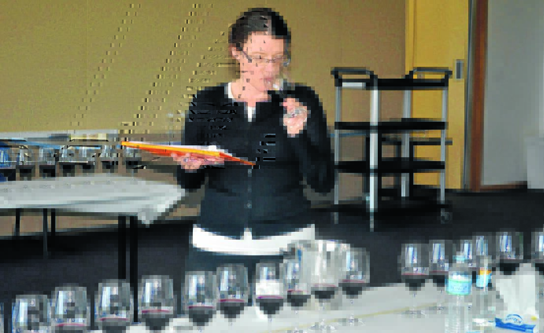 JUST A TIPPLE: Master of wine and head judge Toni Paterson was one of four judges at the Orange Wine Show this week. Photos: NADINE MORTON 1017nmjudging4