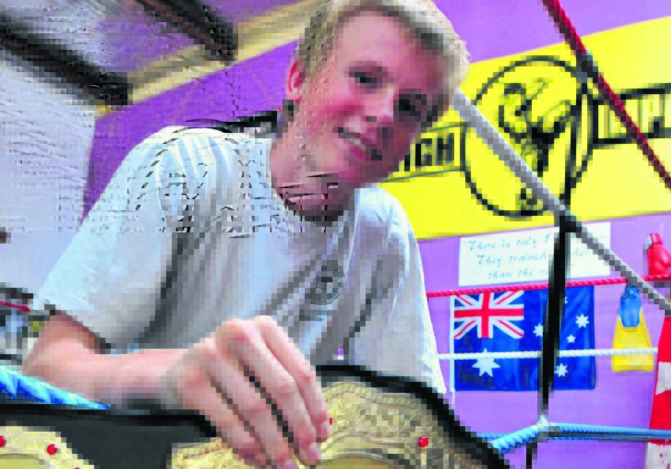LOOK AT MUAY: High Impact's Charlie Bubb with his ISKA state champion belt.  Photo: JUDE KEOGH 0221impact2