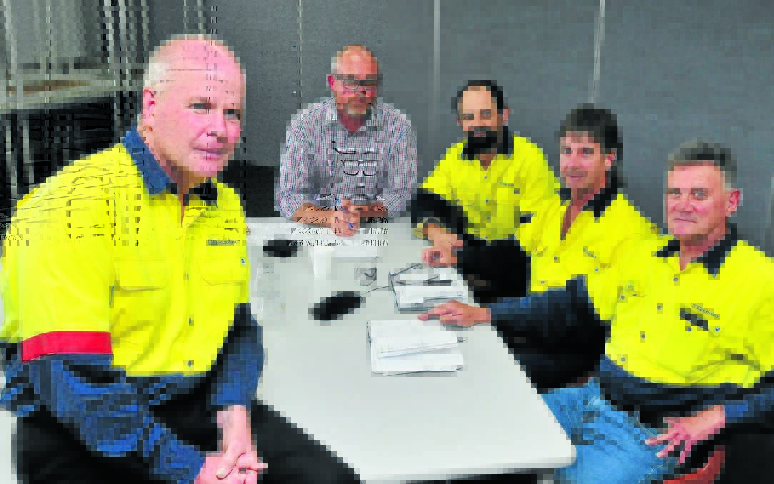 HIGH DOLLAR Is COLD COMFORT: Electrolux Orange manager Mark O’Kane, Tim Ayres from the AMWU and union delegates Justin McKenzie, Tony Cardwell and Ray Jolly following yesterday’s briefing between the union and Electrolux management about the future of the plant.  Photo: JUDE KEOGH 0219