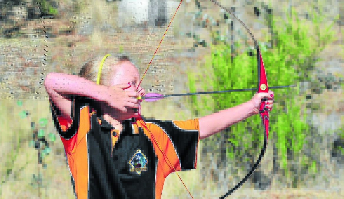 ON TARGET: Cortnae-Jane Fish from Eurobodalla Archers (Batemans Bay) aims her shot during the Walkabout Shoot yesterday.  Photo JUDE KEOGH 