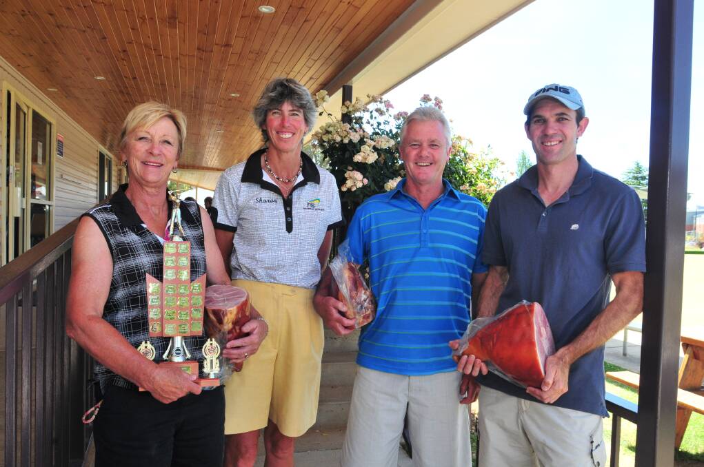 CHRISTMAS CHEER: Kerry Kidd, Sharon Nott, Steve Bray and Greg Wiencke with their spoils from the teachers golf day on Sunday.