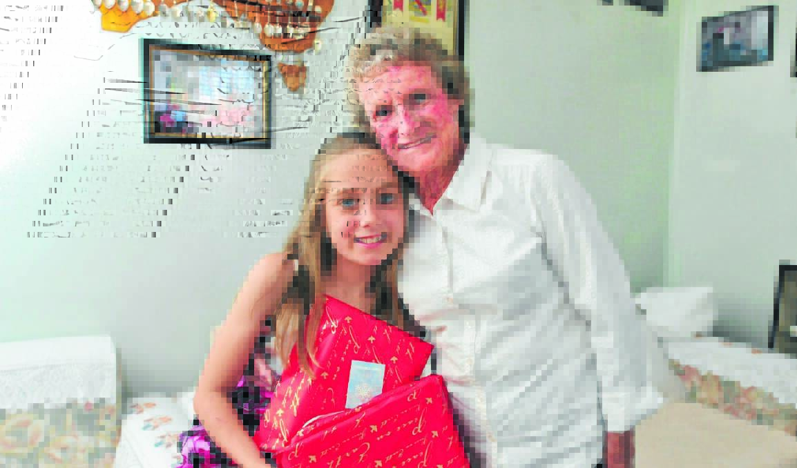 FITTING IN: Chole Armstrong, 10, with her great-grandmother Judith Gant is part of The Smith Family's Learning for Life program to provide her with vital funds for her education. Photo: JUDE KEOGH       1221smith1