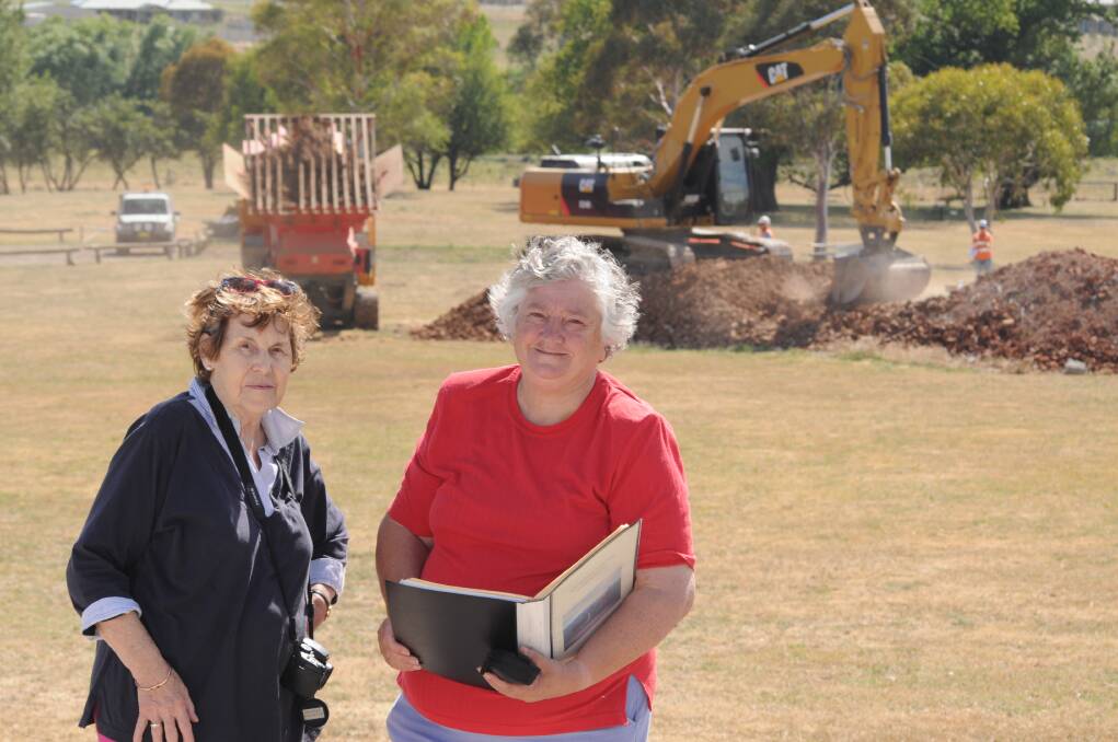 HISTORIC PATH: Orange District Historical Society life members Elizabeth Griffin and Marie Hammond were on hand to witness work get underway to crush bricks at Banjo Paterson Park to form a path.