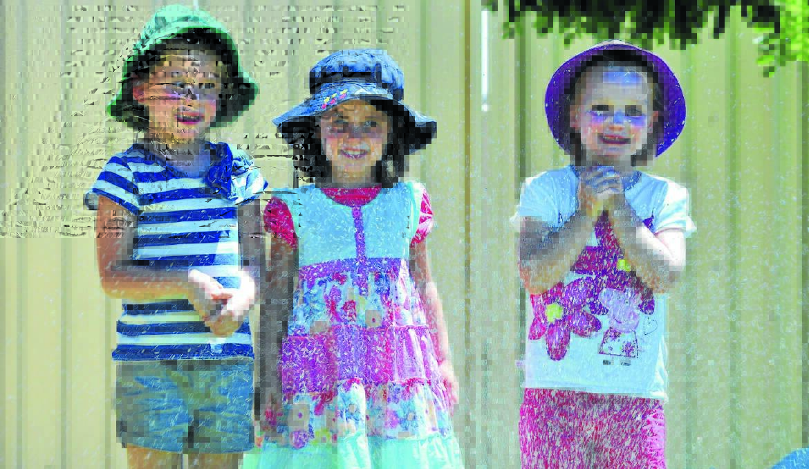 STAYING COOL: Georgie Wishart, Alexandra Ward and Izzie Brooking had lots of fun staying cool yesterday with Orange experiencing one of its driest months on record.  Photo: JUDE KEOGH 0130weather3