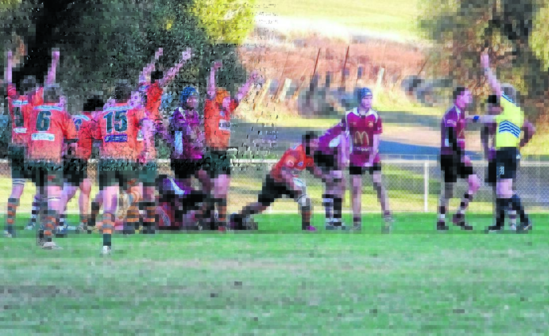 HERE WE GO AGAIN: Mesui Lemoto touches down for the Lions in Orange City's memorable come-from-behind 24-21 win over the Boars in Parkes last year. The Lions will again travel to Parkes when the 2014 season begins on April 5. Photo: PARKES CHAMPION POST