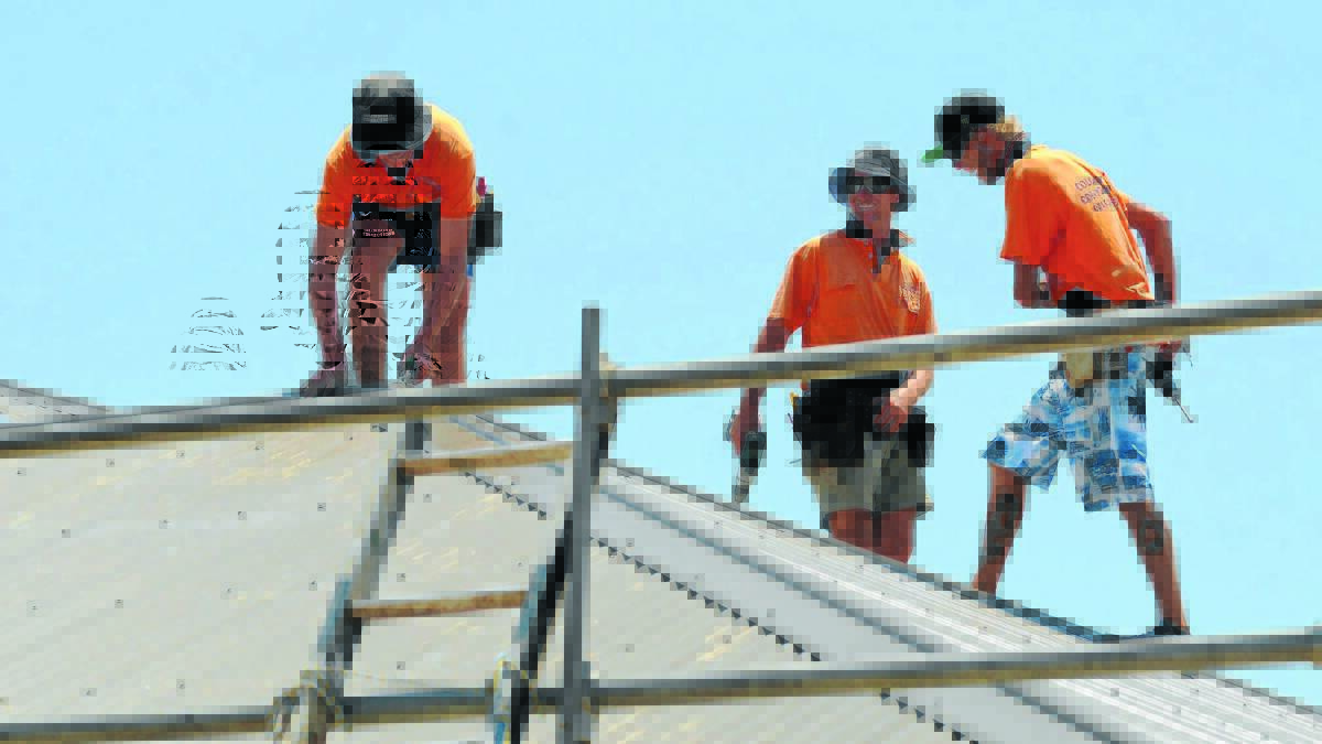 HOT STUFF: Orange roofers Bill Tom, Mark Davis and Rick Humphries regularly work in extreme heat. Photo STEVE GOSCH                                                   0116sgroofing1