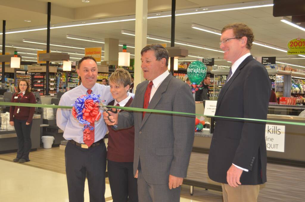 Summer Centre Supa IGA owners Ian and Rochelle Ashcroft officially open the store with member for Calare John Cobb and member for Orange Andrew Gee. 