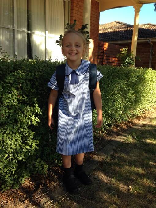 Lily Cordery heads off to start her first day at kindergarten at Orange Christian School. Photo: KRISTY CORDERY