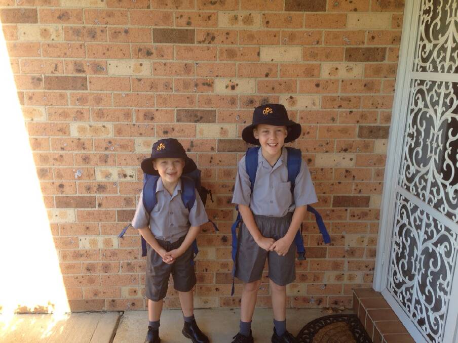 Angus and Oliver Jones head off to Orange Public School. Angus is in year three and Oliver started kindergarten. Photo: LEAH JONES