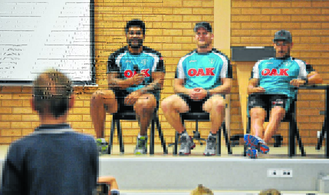 BIG CATS IN TOWN: Penrith Panthers (from left) Mose Masoe, Nigel Plum and Lewis Brown at St Mary's Primary School yesterday.                                                                       Photo: NICK McGRATH 0208nmPanthers