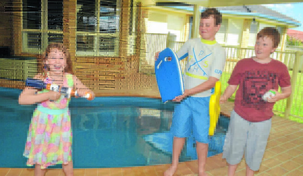 WATER FIGHT: The pool owned by Elle, Trent and Damien Johnson and the estimated 1000 across Orange will need to be registered by October 29 or the owners risk a fine.  Photo: CLARE COLLEY 1008ccpool1