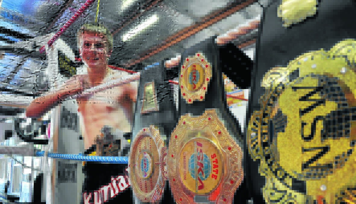 THE BUBBA BELT: Charlie Bubb is fast gaining a serious belt collection after the 16-year-old muay thai fighter won yet another title in Canberra last month. Photo: NICK McGRATH 1211nmbubb2