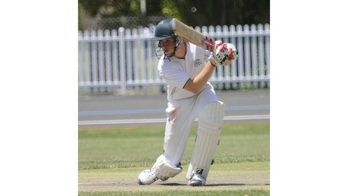 GAME ON: Mitchell's Connor Farnell plays a shot on the way to his side winning their Under 16s Western Zone match against Lachlan. Photo: CHRIS SEABROOK