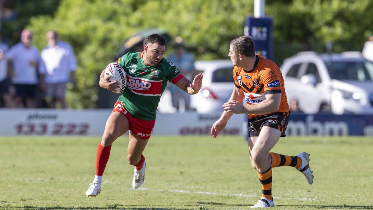 Tony Pellow (left) takes on a defender during Wynuum Manly's win over Brisbane Tigers on the weekend. Picture by Wynuum Manly Seagulls