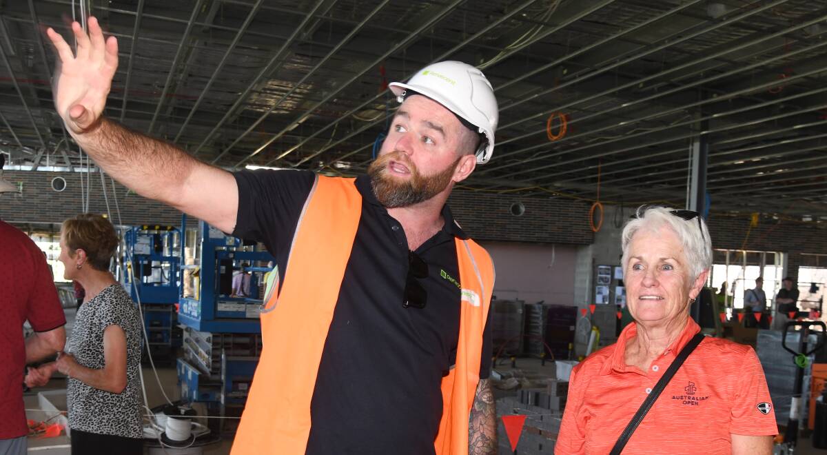 Jack Braddon shows Karen Newton how the new Wentowrth Golf Club building is taking shape. Picture by Carla Freedman