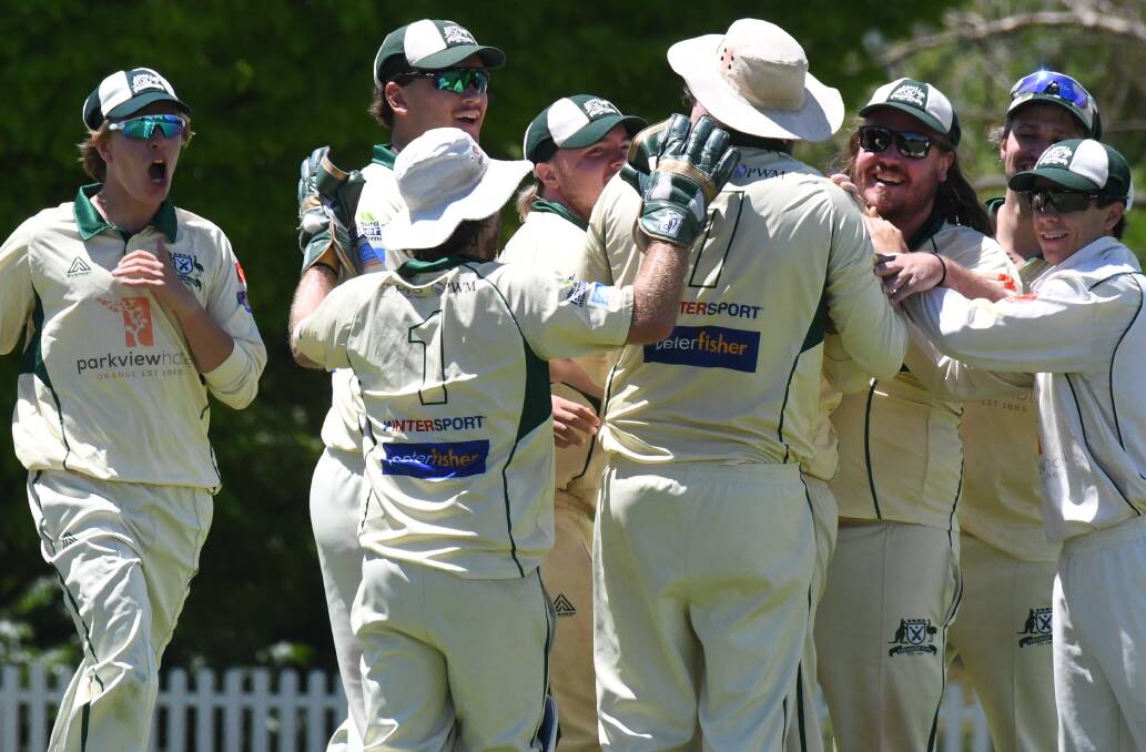 Orange City celebrate another wicket as they bowled CYMS out for 220. Picture by Jude Keogh