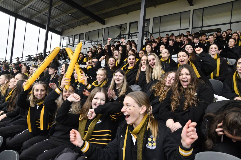 Orange High School students cheer on the rugby league team during their tie with Dubbo College at Wade Park. Picture by Carla Freedman