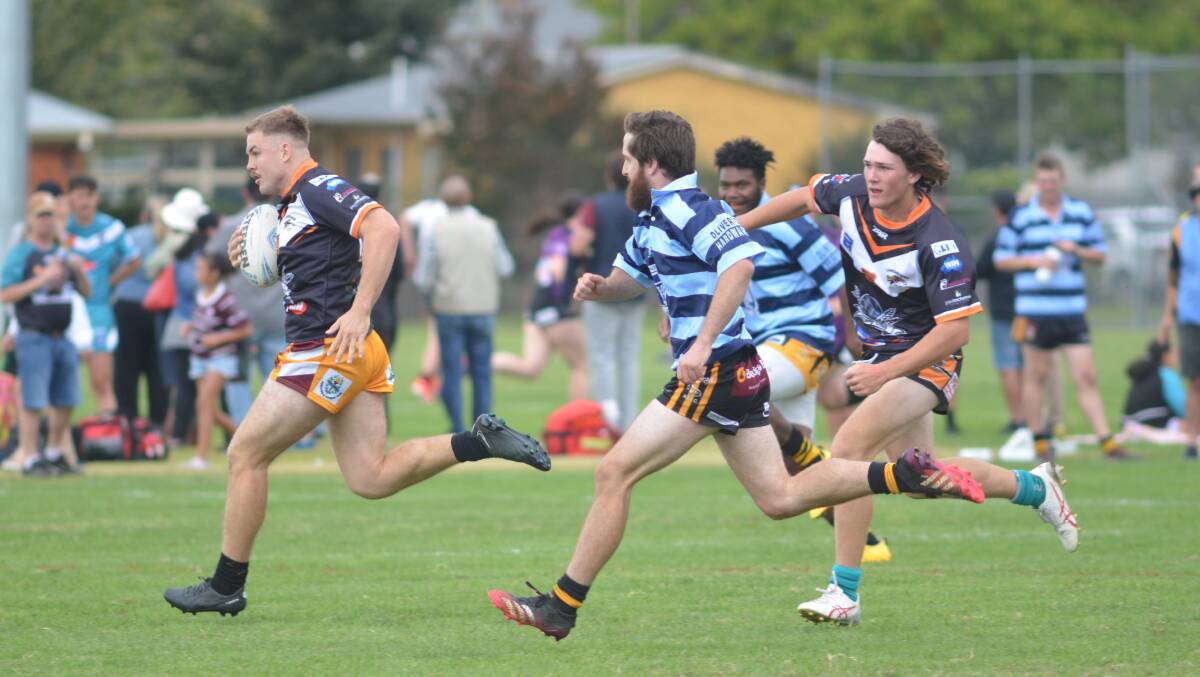 Zac Hunt races away for a try for Canowindra Tigers against Grenfell Goannas. Picture by Dominic Unwin