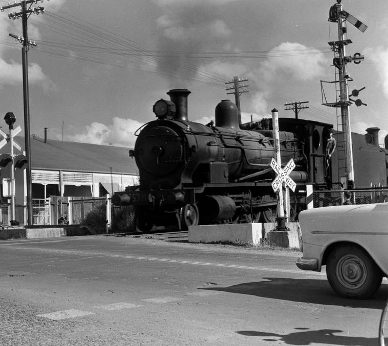 A steam locomotive makes its way through Orange. Picture by Orange District Historical Society