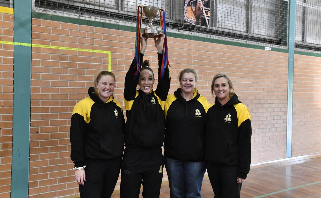 Tegan Dray lifts the centenary Astley Cup. Picture by Carla Freedman