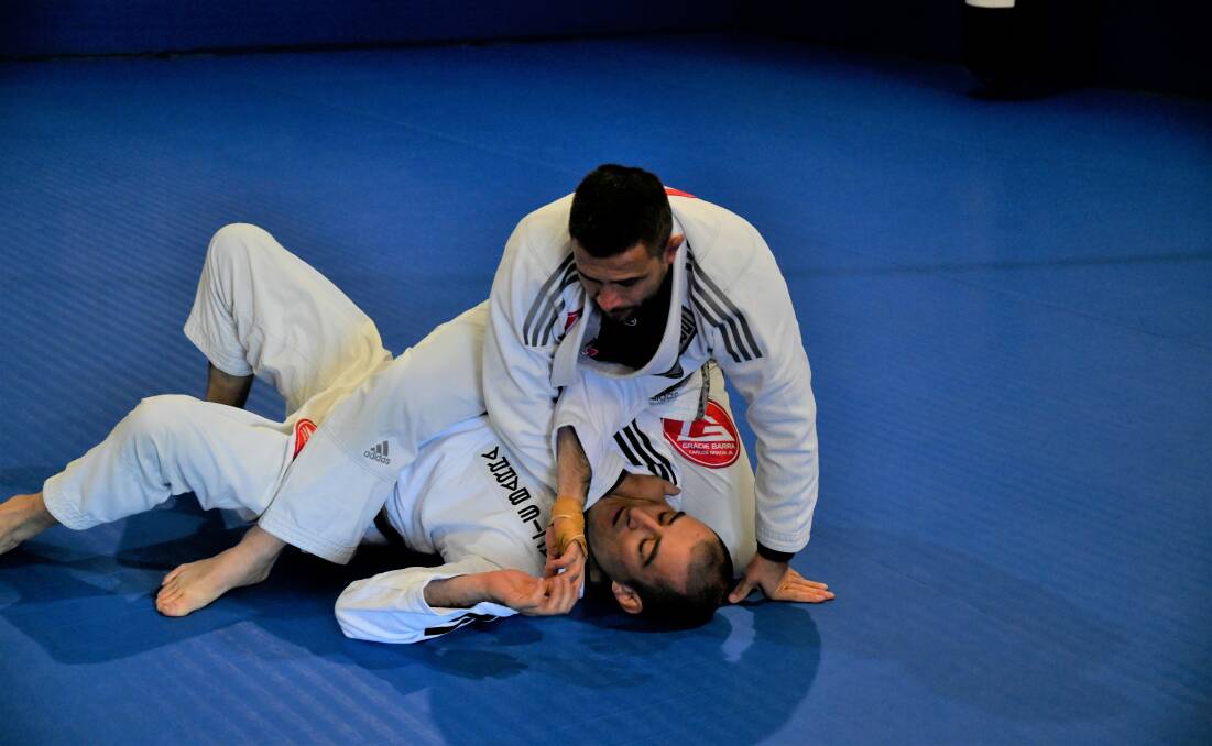 Adriano Magnani and Luke Engle give a demonstration of Brazilian jiu-jitsu. Picture by Carla Freedman