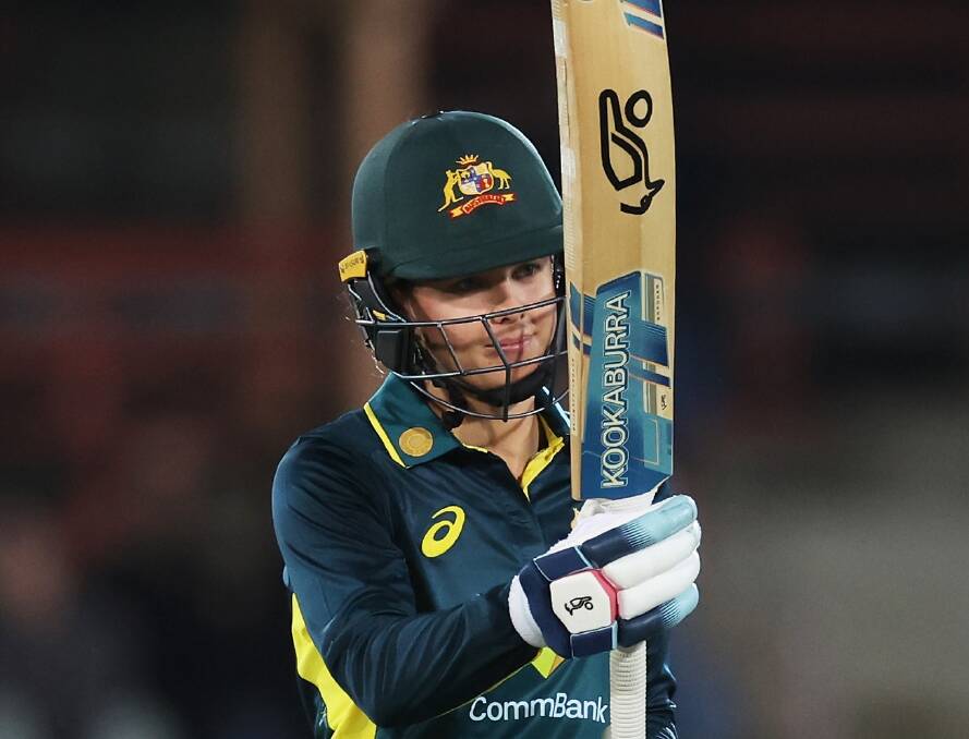 Phoebe Litchfield raises her bat after scoring 50 for Austarlia in their T20I match against West Indies. Picture by Australian Woimen's Cricket team (Facebook)