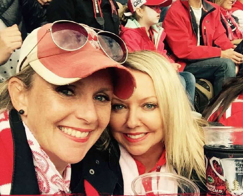 Karen McMurray (right) at the 2016 AFL grand final. The Sydney Swans would go on to lose against the Western Bulldogs. Picture supplied
