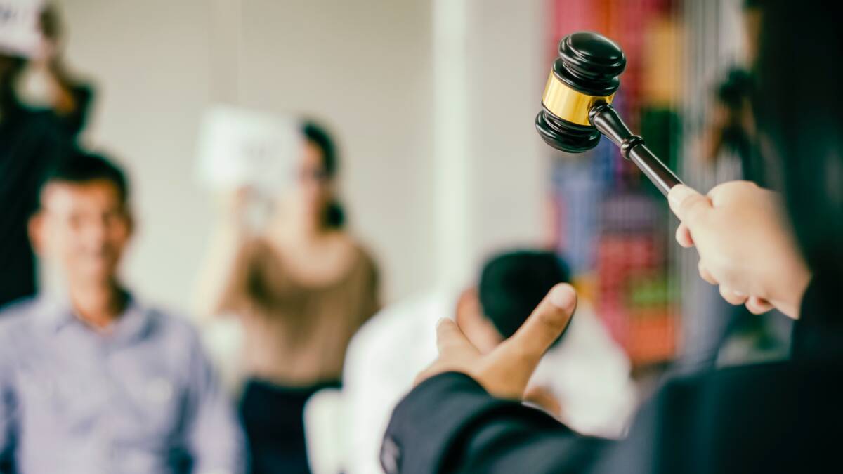 In-person property auctions are now permitted in NSW, with vaccination requirements varying according to the premises. Photo: Shutterstock