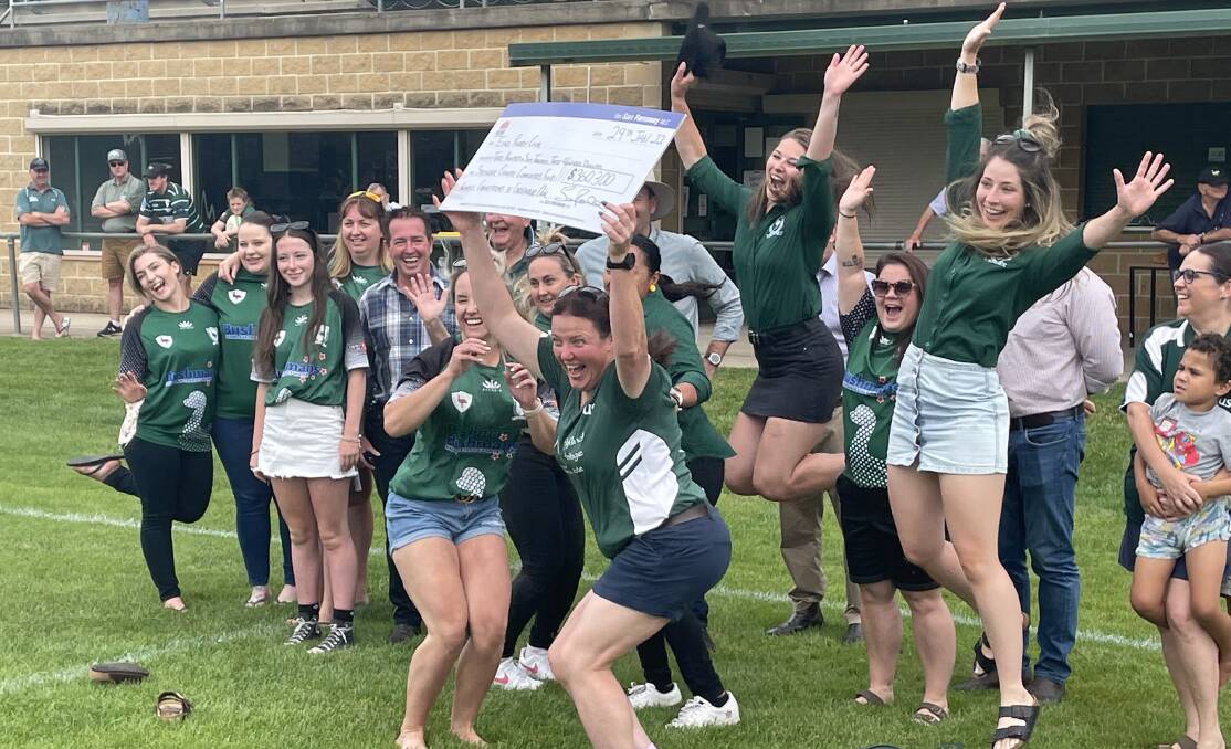 JOY: Amanda Ferguson and some of the womens players, with the funding for the construction of female change rooms at Endeavour Oval. Photo KATE BOWYER