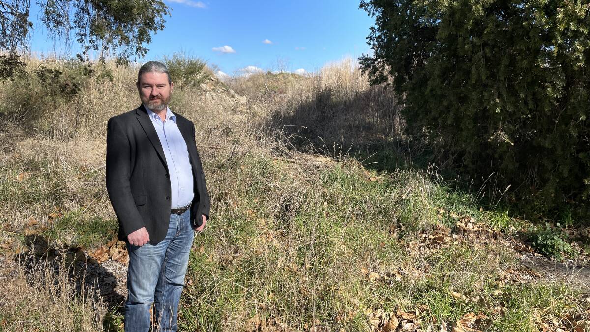 LAND USE: Cr David Mallard on the McNeilly Avenue site which was the home of the Orange Saleyards, before it was closed in 2008. Photo KATE BOWYER