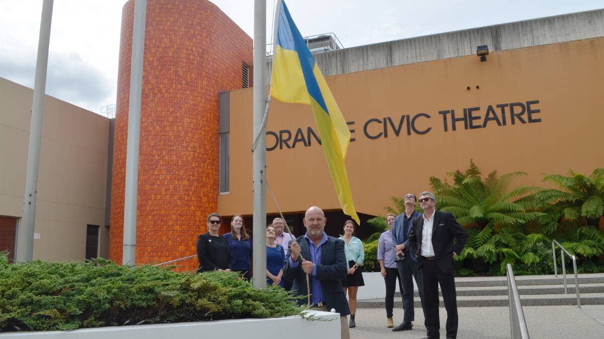 SHOW OF SUPPORT: Orange Mayor Jason Hamling hoists the Ukrainian flag on Thursday. Photo supplied