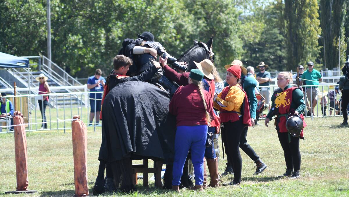 CONCUSSION: Meika Letich is assisted from her mount, Valiant, during Sunday's jousting competition at the Orange Showground. Photo CARLA FREEDMAN