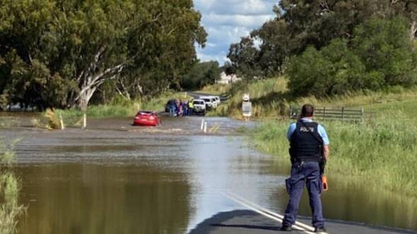 DECEPTIVE DEPTH: Emergency services assisted a man after his car stalled in a flooded creek. Photo: CONTRIBUTED
