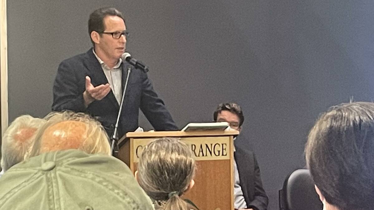 Orange City Council's Director of Development Mark Hodges addresses about 80 people during Thursday's housing future forum.
