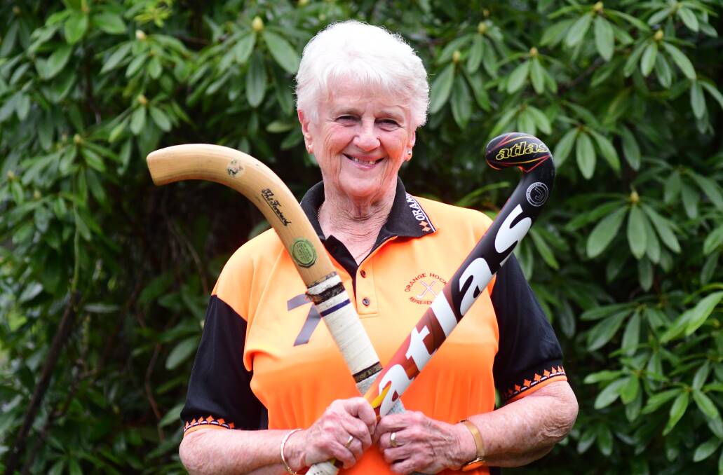STICKING WITH IT: Gail Pringle with one of her first hockey sticks and the one she uses when taking the field these days. Photo JUDE KEOGH