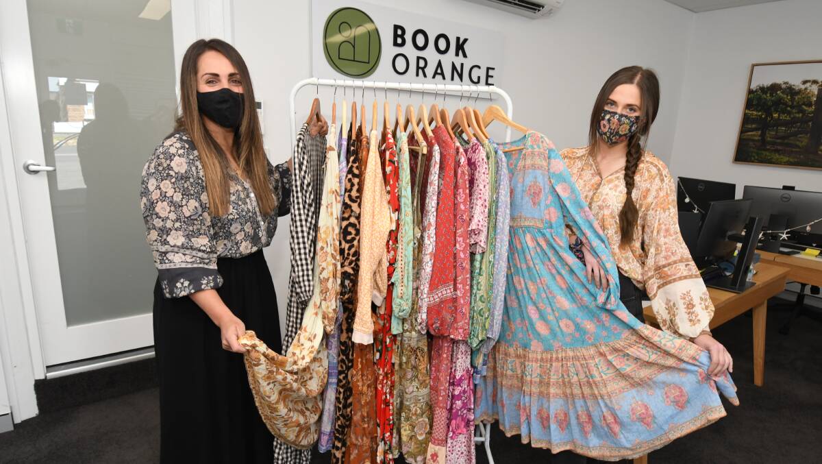 STYLISH SOLUTION: Bec Hammond and Saskia Jones with a sample of what will be offered at the Book Orange clothing market. Photo JUDE KEOGH