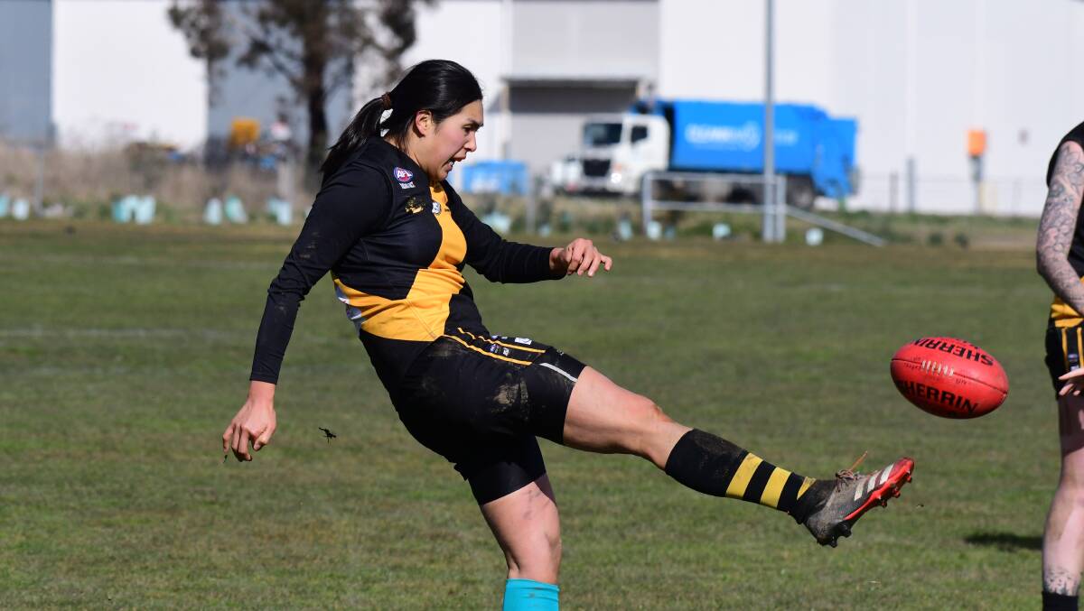 Jennifer Lao gets things moving for the Tigers. Photo JUDE KEOGH