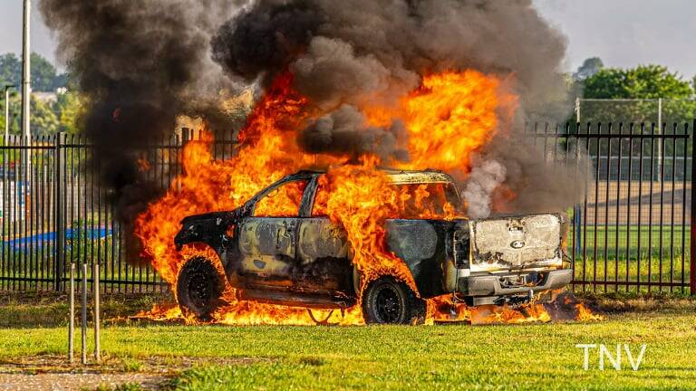 NOT CRICKET: Energency services put out the fire that engulfed the Ford Ranger on Glenroi Oval. Photo TROY PEARSON