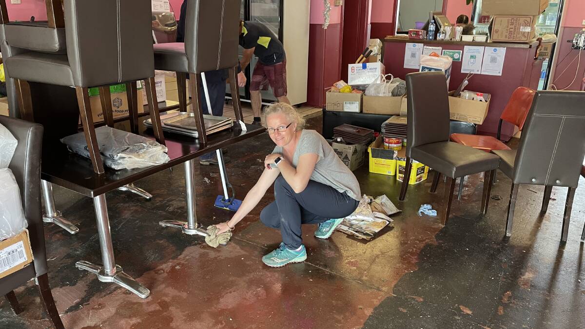 BUSY BEE: Belinda Mills was helping with the cleanup at the Wing Hang Chinese Restaurant.
