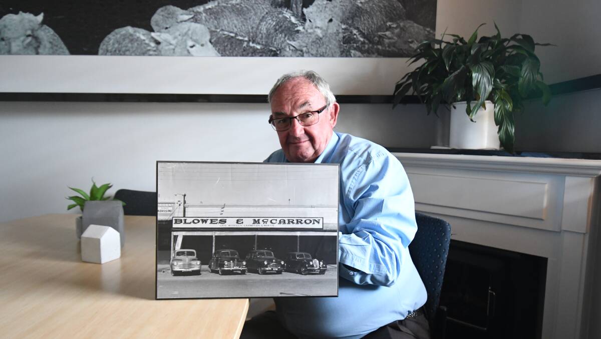 WAY WAY BACK: Gary Blowes with a pictured of his father's first business. Photo CARLA FREEDMAN